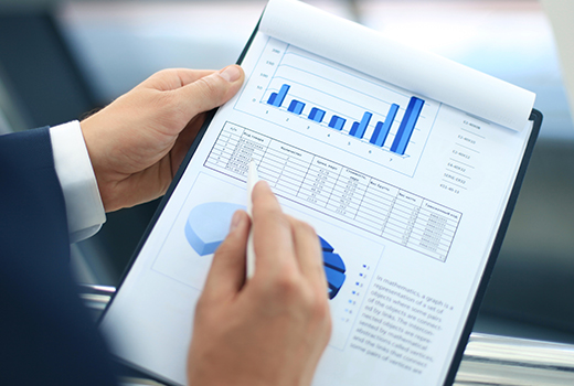 person holding a clip board with growth chart