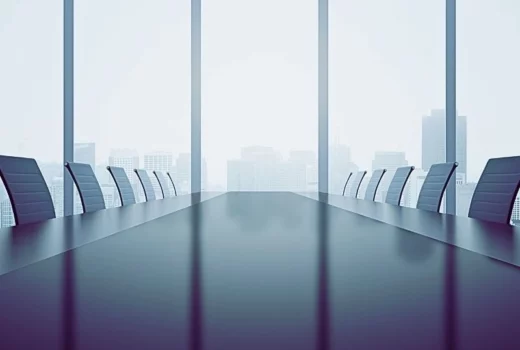 Closeup of shiny dark table and chairs in conference room interior with city view and daylight.