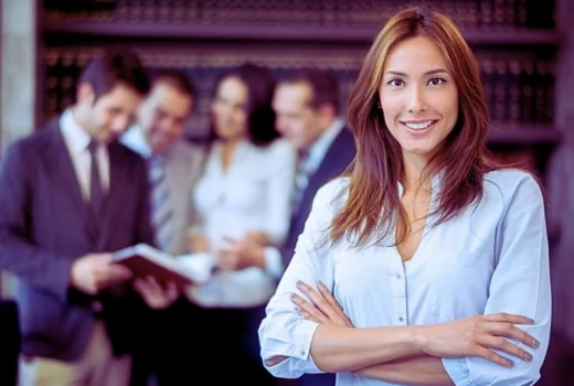 Business woman leading a group at the office