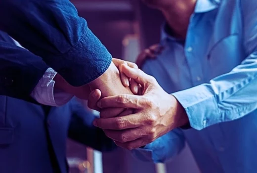 Men shaking hands, finishing up meeting.